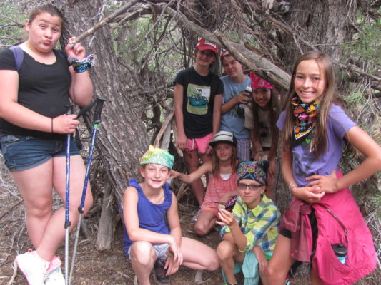 young girls posing on a group hike, enjoying outdoors, women's empowerment workshop
