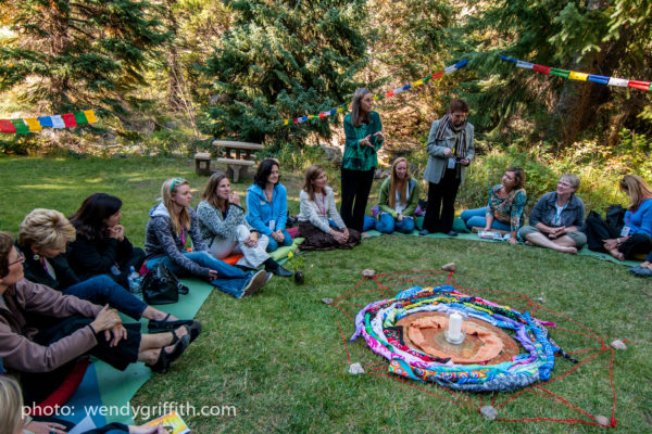 womens circle outside at a retreat, women's empowerment workshop
